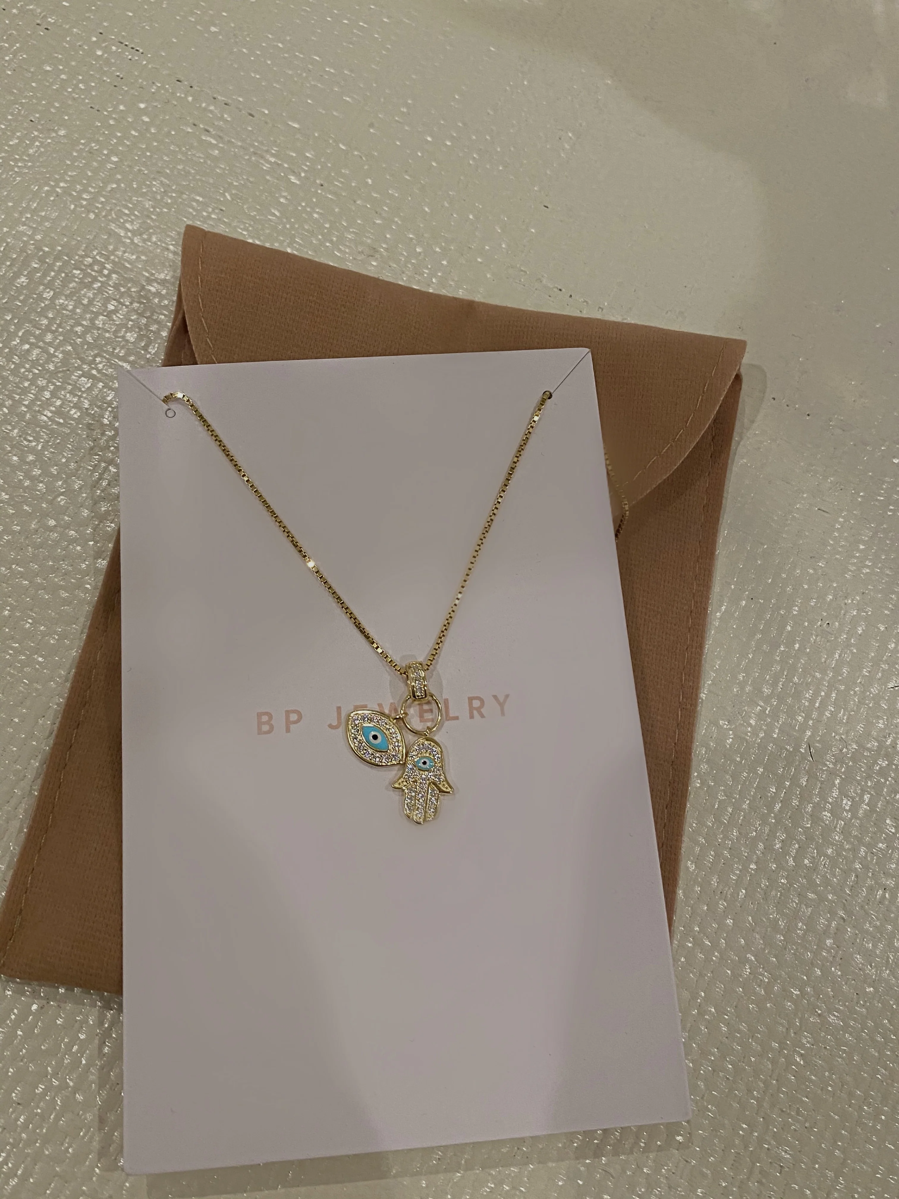 The Gold Evil Eye Hamsa Double Charm Necklace